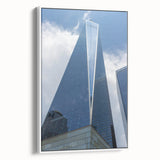 Vintage poster art of NYC Trade Center in colorful palette on white framed canvas, ideal for living room decor.