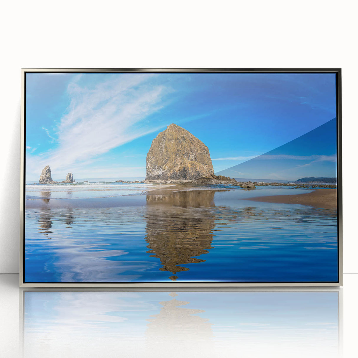 Mid-century modernist art depicting Oregon's Cannon Beach with muted gray and blue tones on a framed acrylic print.