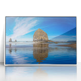Acrylic print of Cannon Beach in Oregon, with muted gray and blue tones, framed in white, ideal for modern art wall decor.