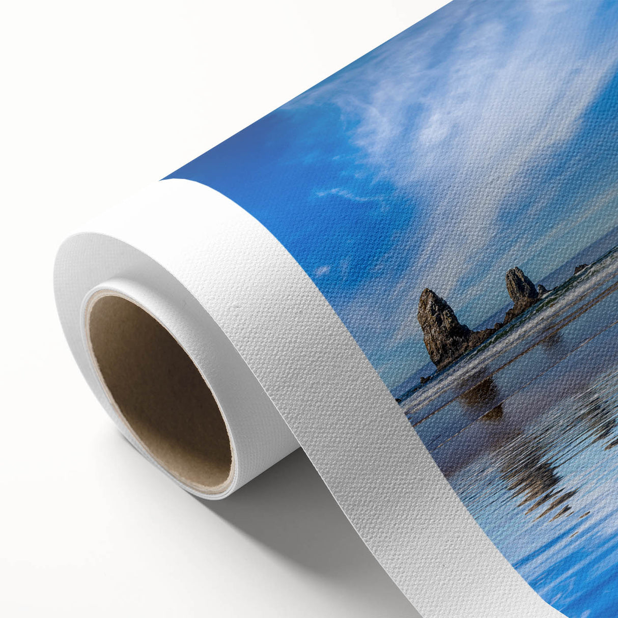 Art Deco poster of Cannon Beach, Oregon on rolled canvas, featuring soft pastel colors, ideal for nursery wall art.