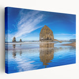 Large art print of Cannon Beach, Oregon, with muted earth tones on stretched canvas, ideal for kitchen wall art.