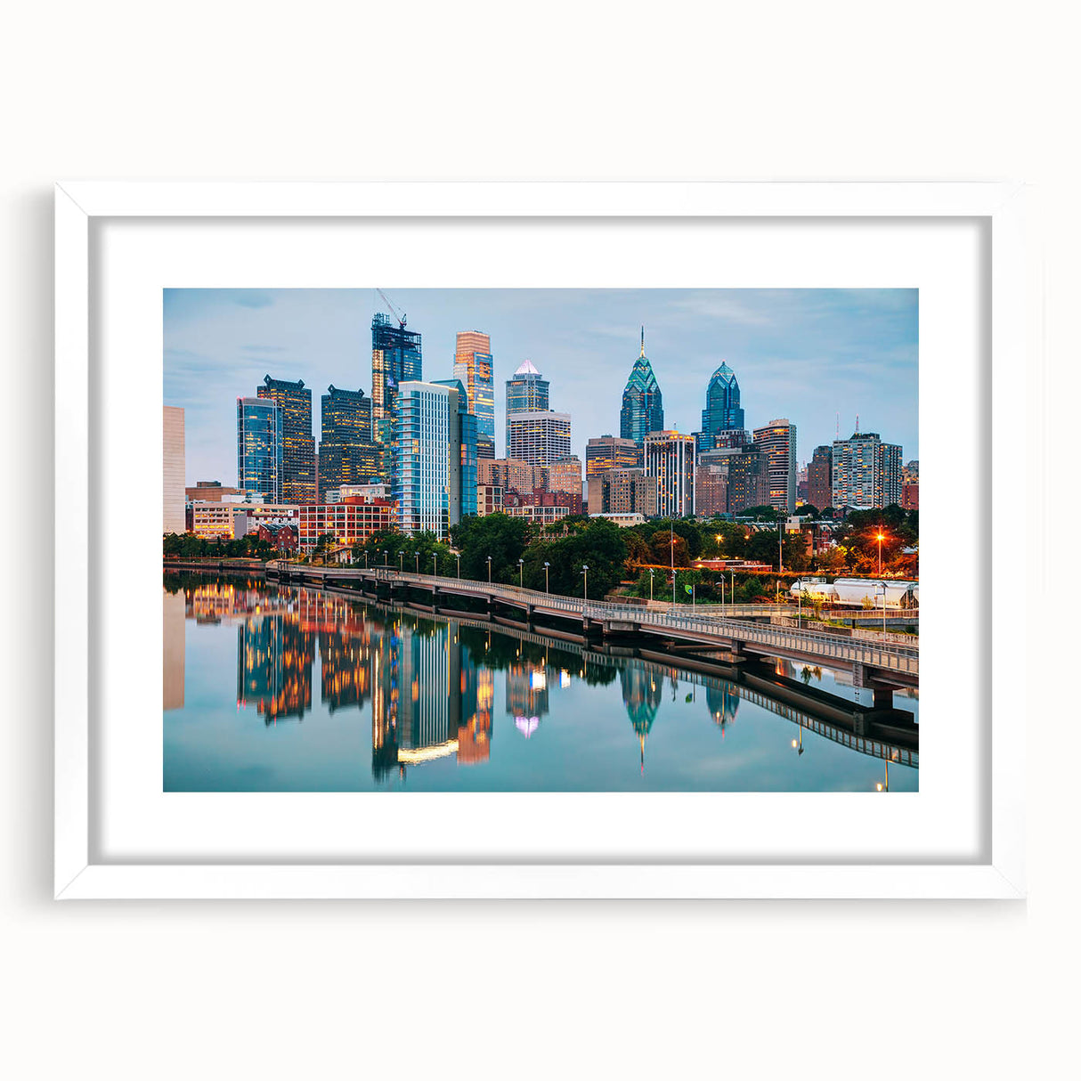 Abstract art print of Philadelphia skyline in muted blue and gray tones on a framed white mat, ideal for dining room decor.