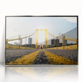 Mid-century modernist art of Pittsburgh skyline in muted gray and blue tones on a silver-framed acrylic print.