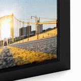 Close-up of textured black wall art depicting the Pittsburgh skyline with vibrant colors, framed canvas.