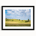 Abstract art print of South Dakota scenery in vibrant colors on a large framed canvas, suitable for living room decor.