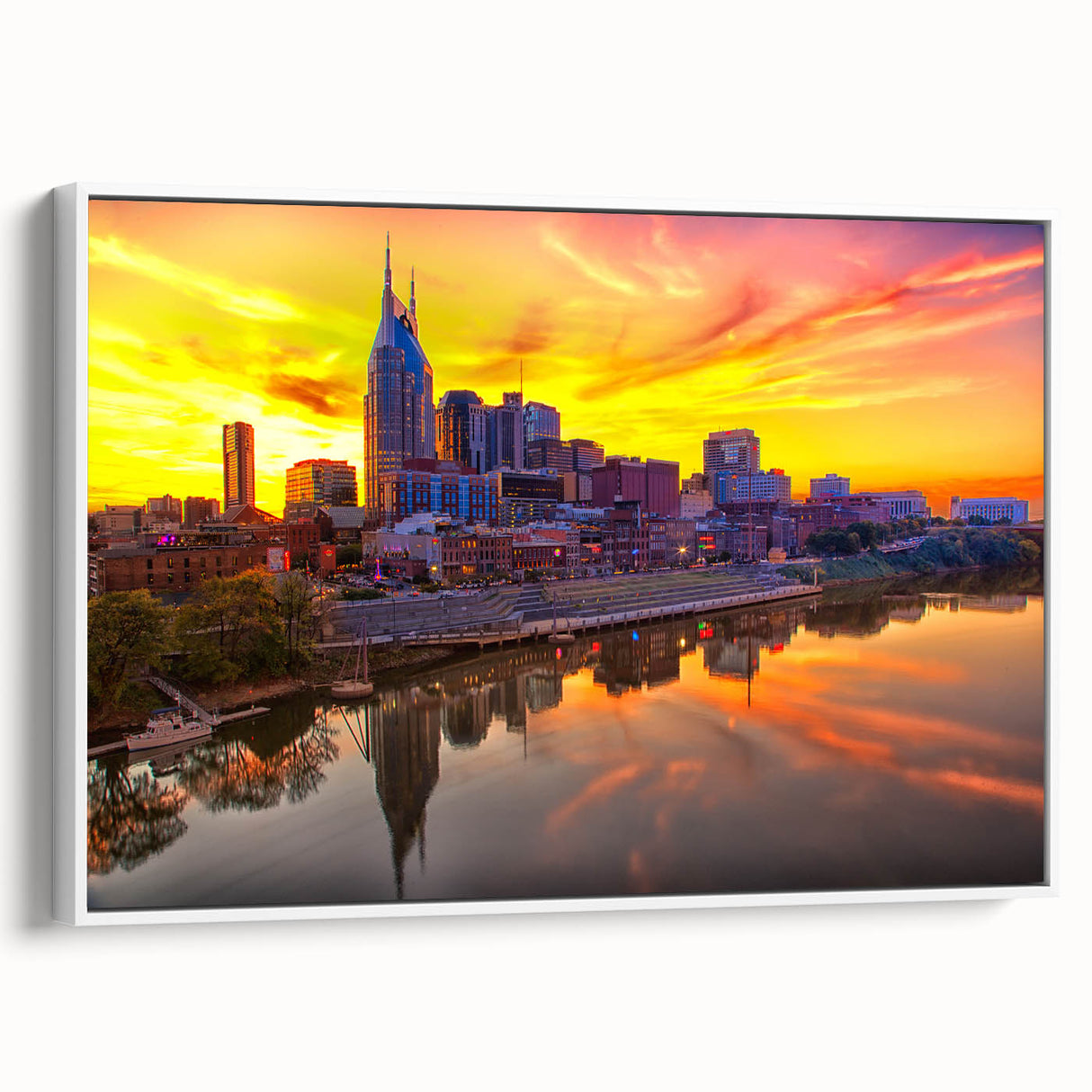 Framed canvas of vintage poster art featuring Nashville skyline in vibrant colors on a white background.