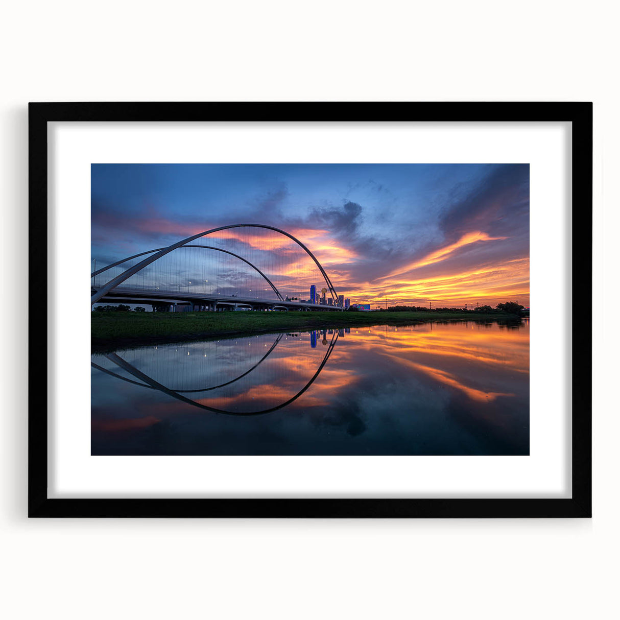 Extra large abstract art print of Dallas skyline in vibrant colors on textured canvas, framed in black.
