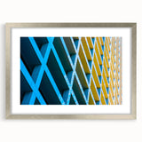 Textured abstract art print of Houston skyline in muted earth tones on a framed silver mat, suitable for bedroom decor.