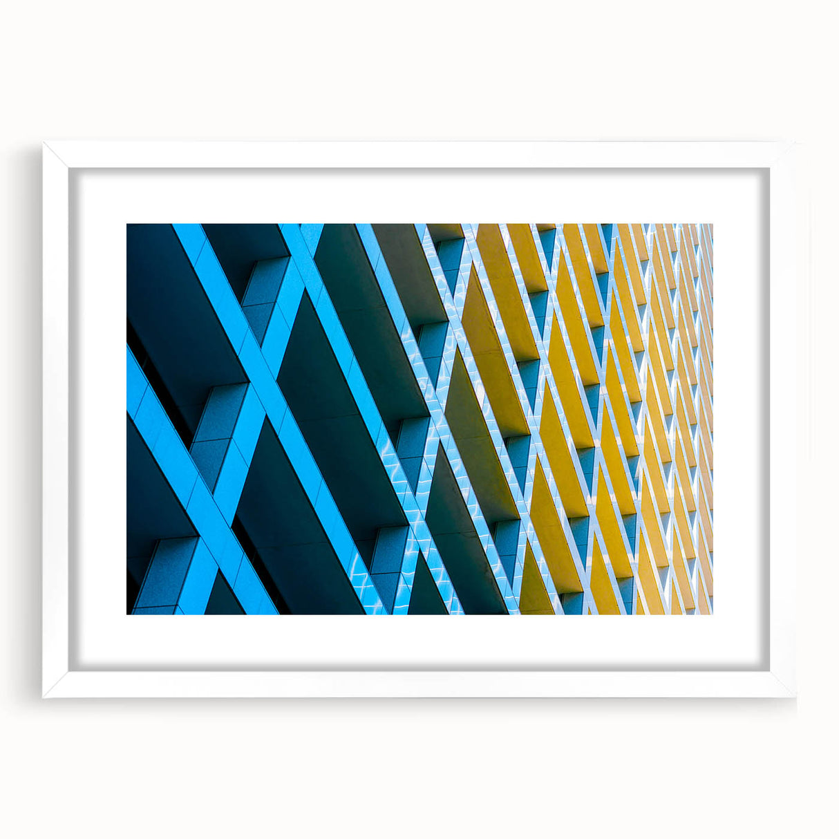Abstract art print of Houston skyline in muted gray and blue tones on a framed white mat, ideal for dining room decor.