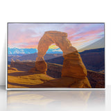 Acrylic print of Arches National Park in muted earth tones, framed in white, suitable as modern art wall decor.