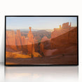 Large abstract wall art of Bryce Canyon with vivid orange and red tones on black framed acrylic.