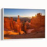 Framed canvas of vintage poster art depicting Bryce Canyon in vibrant red and orange tones, ideal for living room decor.
