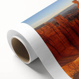 Art deco poster of Bryce Canyon in pastel orange and blue shades on rolled canvas, suitable for nursery wall art.