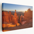 Large art depicting the Bryce Canyon in Utah with warm orange and red tones on a stretched canvas.
