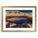 Extra large abstract print of Utah's Canyonlands in muted earth tones on a textured canvas, framed in gold.