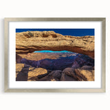 Textured art of Utah Canyonlands in abstract style, with earthy tones on a silver-framed mat, suitable for bedroom decor.