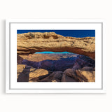 Abstract art print of Canyonlands with muted earth tones on a framed white mat, ideal for dining room decor.