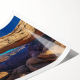 Extra large wall art of a line art floral design in muted earth tones on a rolled canvas.