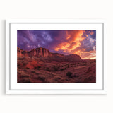 Abstract art print of Capitol Reef in Utah with vibrant red and orange tones on a white-framed canvas.