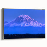 Landscape art painting depicting Mount Rainier, with vibrant green and blue tones on a framed canvas.