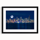 Extra large abstract art print of Seattle skyline in vibrant colors on textured canvas, framed in black.