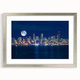Textured art print of abstract Seattle skyline in silver frame, with muted blue and gray tones, ideal for bedroom art.