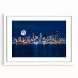 Abstract art print of Seattle skyline in muted gray and blue tones, framed with a white mat, ideal for dining room decor.