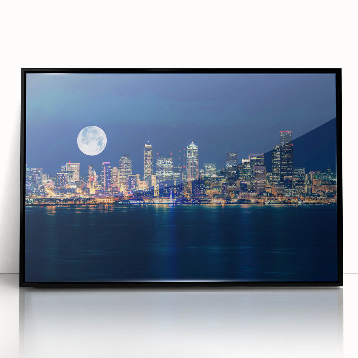 Large abstract wall art of Seattle skyline in muted gray and blue tones, acrylic print in black frame.