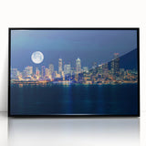 Large abstract wall art of Seattle skyline in muted gray and blue tones, acrylic print in black frame.