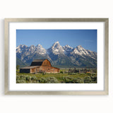 Textured art print of the Grand Tetons in muted earth tones on a framed canvas, suitable for bedroom decor.