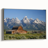 Framed canvas of Grand Tetons landscape in muted earth tones, ideal for a living room or office.