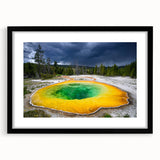 Colorful abstract art print of Yellowstone scenery in vibrant hues on a large framed canvas, ideal for living room decor.