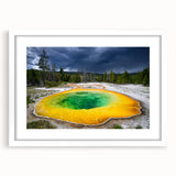 Abstract art print of Yellowstone with vibrant earth tones on a white framed canvas, ideal for dining room decor.