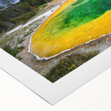 Art deco poster of Yellowstone scenery on rolled canvas, featuring muted earth tones, ideal for dining room wall art.