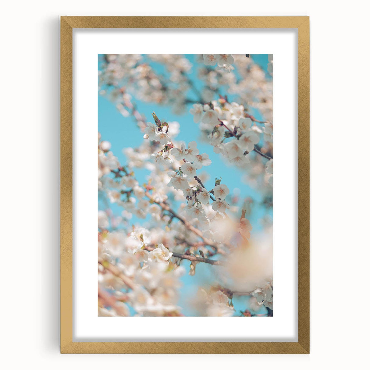 Abstract art print featuring textured layers in soft green and beige, framed in gold, ideal for living room decor.