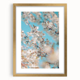Abstract art print featuring textured layers in soft green and beige, framed in gold, ideal for living room decor.