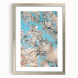 Textured art print depicting abstract spring motifs in pastel shades on a silver-framed mat, ideal for bedroom decor.