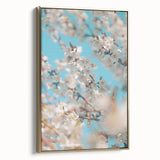 Framed canvas depicting a spring landscape with blooming trees in pastel colors, ideal for bedroom wall art.