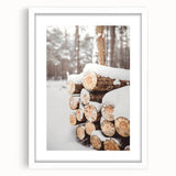 Abstract art print depicting a winter scene in muted blue and white tones on a framed white canvas.