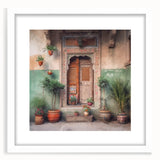 Abstract art print of an Indian door in muted earth tones on a framed white mat, suitable for dining room decor.