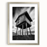 Textured abstract art print in muted gray and silver tones, framed in silver, ideal for modern bedroom ambiance.
