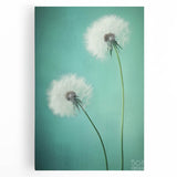 Floral and botanical stretched canvas wall art featuring vibrant green leaves and delicate pink flowers against a soft cream background, ideal for home decor.
