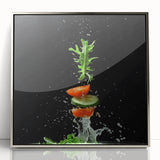 Mid-century modernist art depicting assorted fruits in vibrant colors on a silver-framed acrylic.