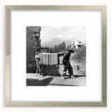 Textured abstract art print featuring a blend of muted earth tones in a silver frame, ideal for bedroom art.