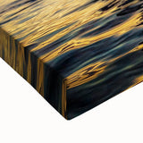 Close-up of a stretched canvas showcasing vibrant African tribal wall art, highlighting intricate patterns and textures, perfect for home decor or cultural display.