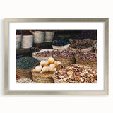 Abstract art print of an Egyptian landscape in muted earth tones on a framed silver mat, ideal for dining room decor.