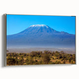Vintage poster art of a Kenyan landscape on framed canvas, featuring vibrant colors and black accents.
