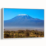 Framed canvas wall art depicting a serene Kenyan landscape in muted earth tones, ideal for bedroom decor.
