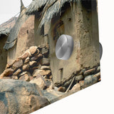 Large abstract wall art depicting a Mali scenery in muted earth tones on acrylic glass, suitable for dining room ambiance.