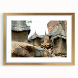 Textured abstract art print depicting a serene Mali landscape in earth tones, framed in gold, ideal for bedroom art.